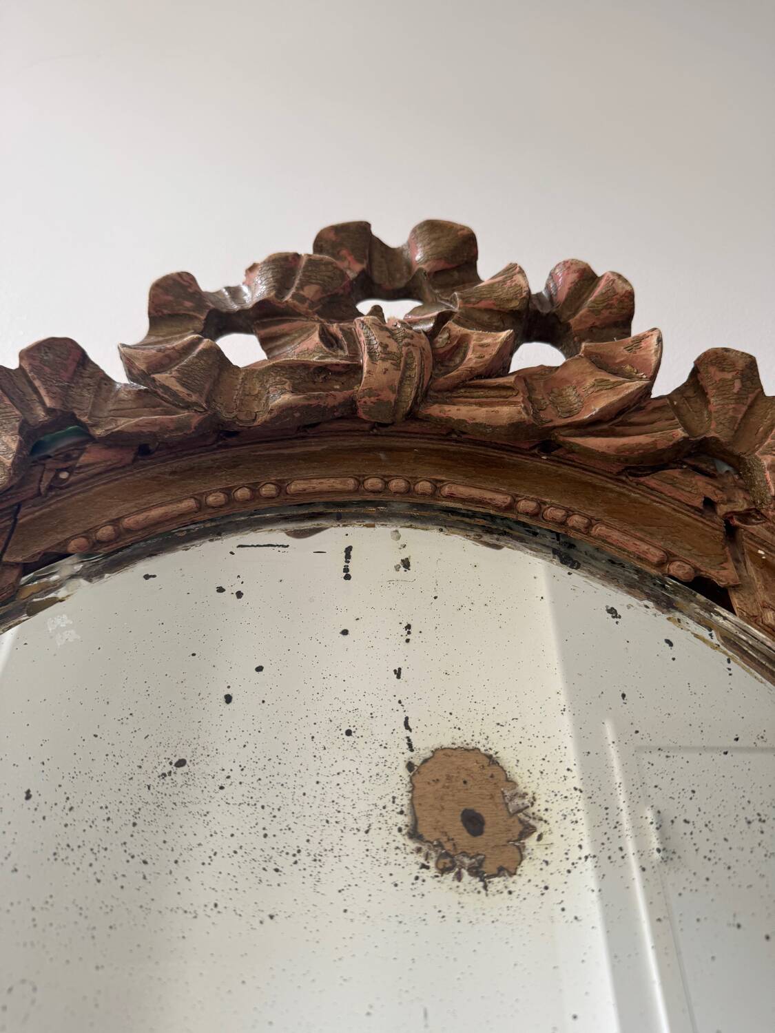 Antique Louis XVI oval knot mirror