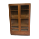 Old school glass bookcase in blond wood