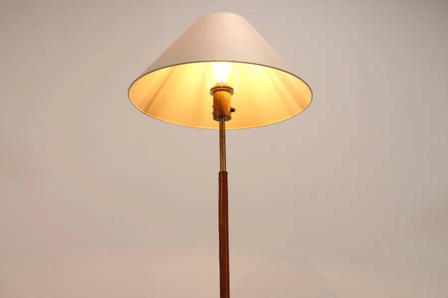 Paavo Tynell style floor lamp in brass and leather with linen shade