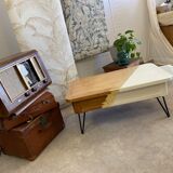 Coffee table with pin legs and gold leaf