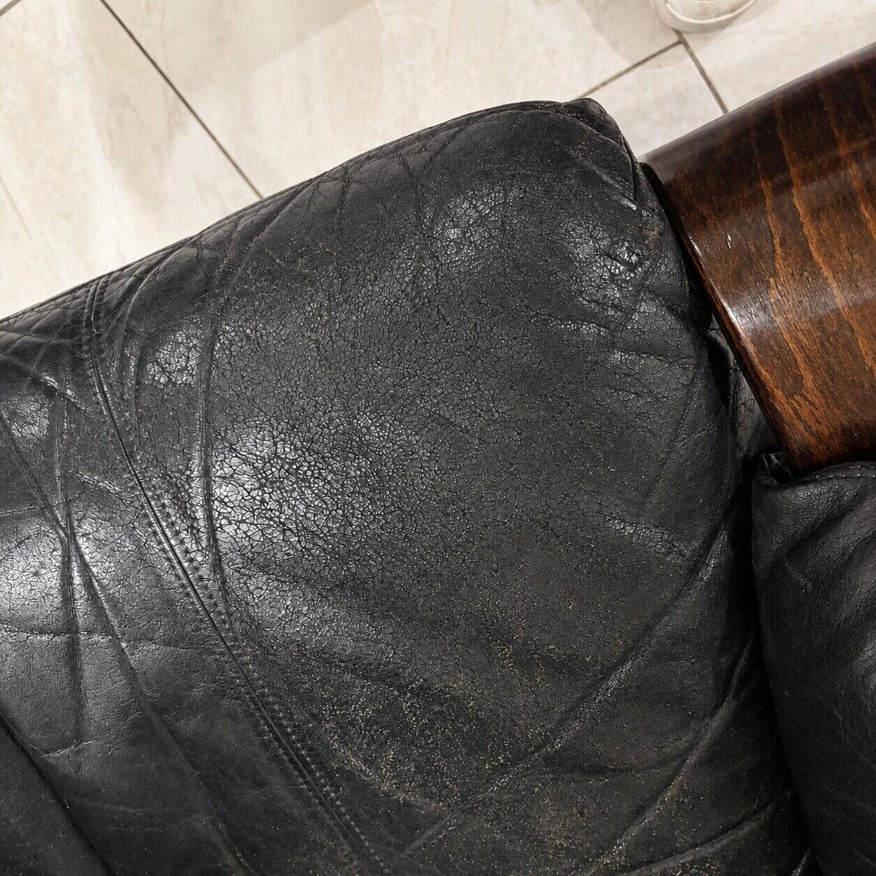 Paire de fauteuils scandinaves en cuir et palissandre