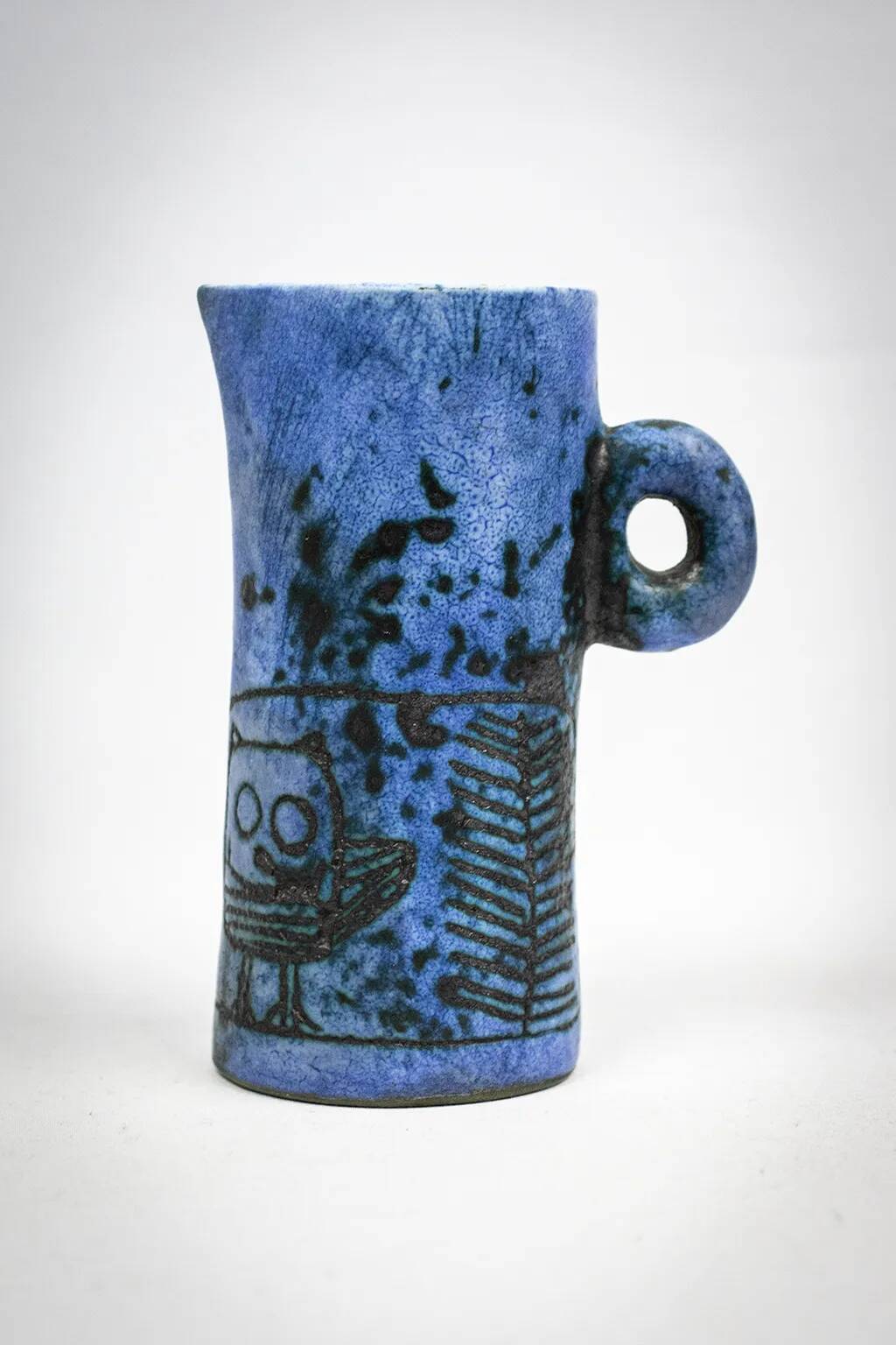Small jug by Jacques Blin in blue ceramic with engraved animal decoration.