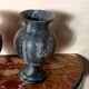 Pair of black serpentine marble vase-urns, early 20th century, Empire style