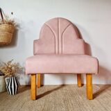 Single bar stool in pink stitched faux leather.