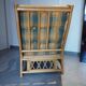 Vintage armchair in bamboo and rattan with a tartan pattern.