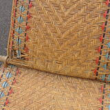 Bain de soleil, chaise longue en rotin