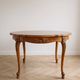 Round Louis XV dining table in solid cherry wood.
