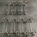 Set of 7 vintage knife rests in the shape of crosses in silver-plated metal.