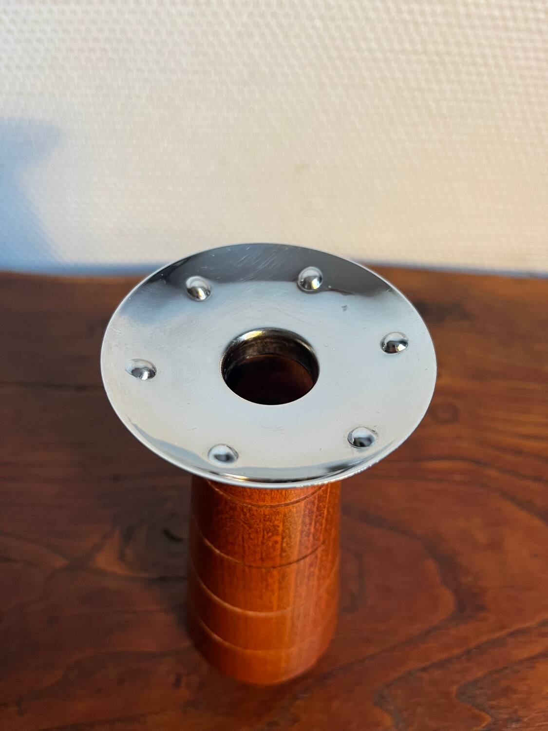 Pair of Guy Degrenne wooden and stainless steel candlesticks