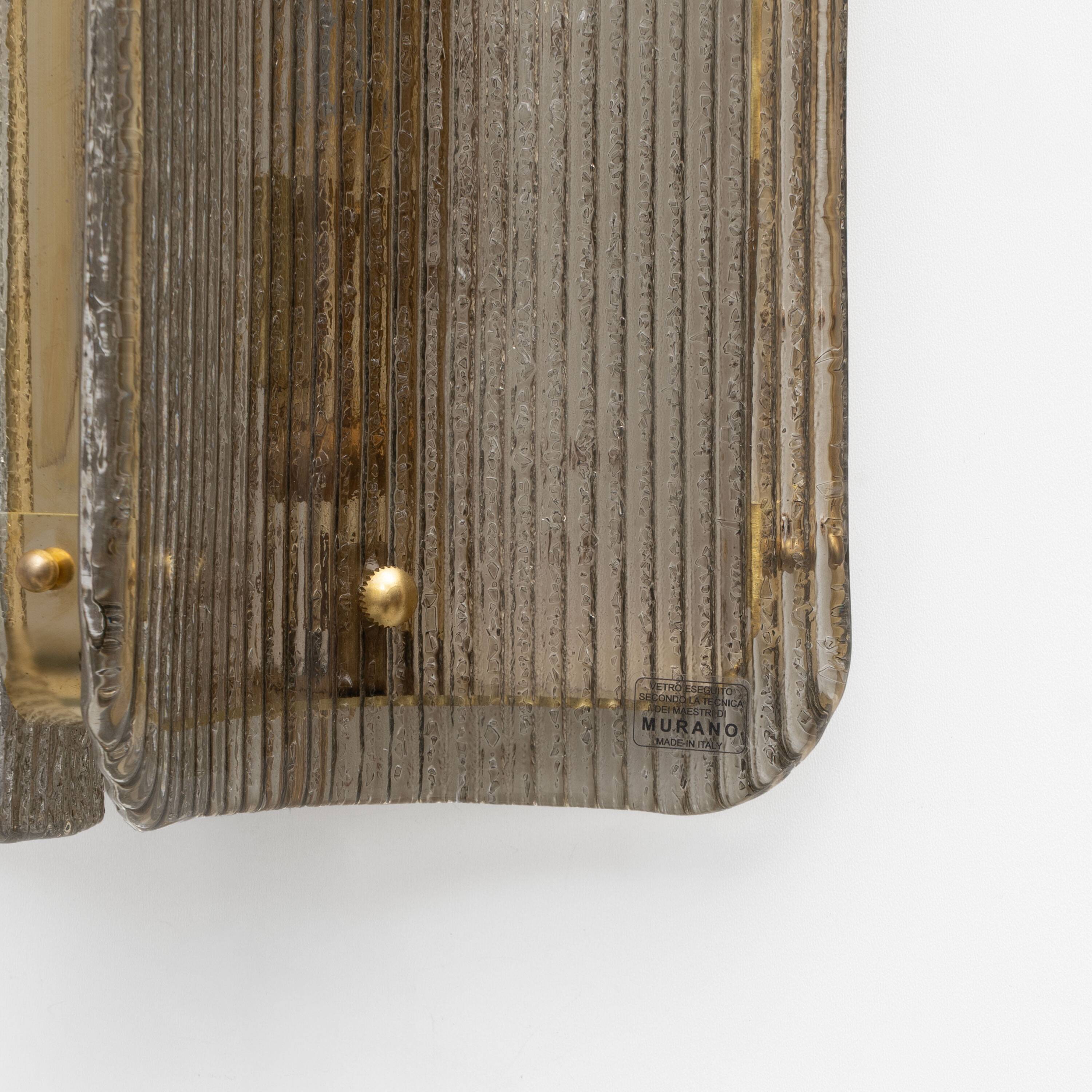 Pair of Curved Ribbed Grey Murano Glass and Brass Wall Sconces