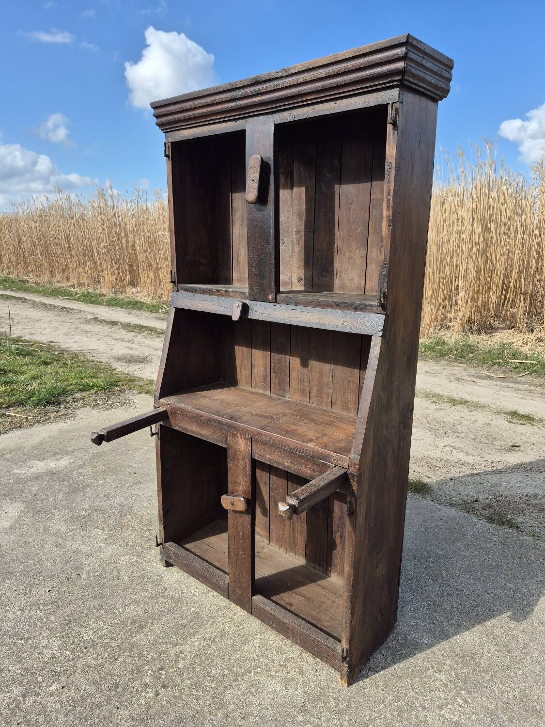 antique cabinet with carvings and wrought iron fittings rural