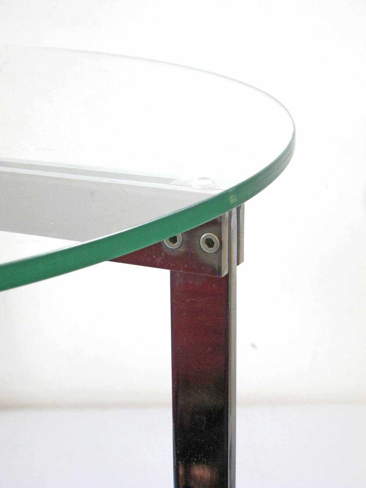 Modernist glass coffee table with stainless steel base