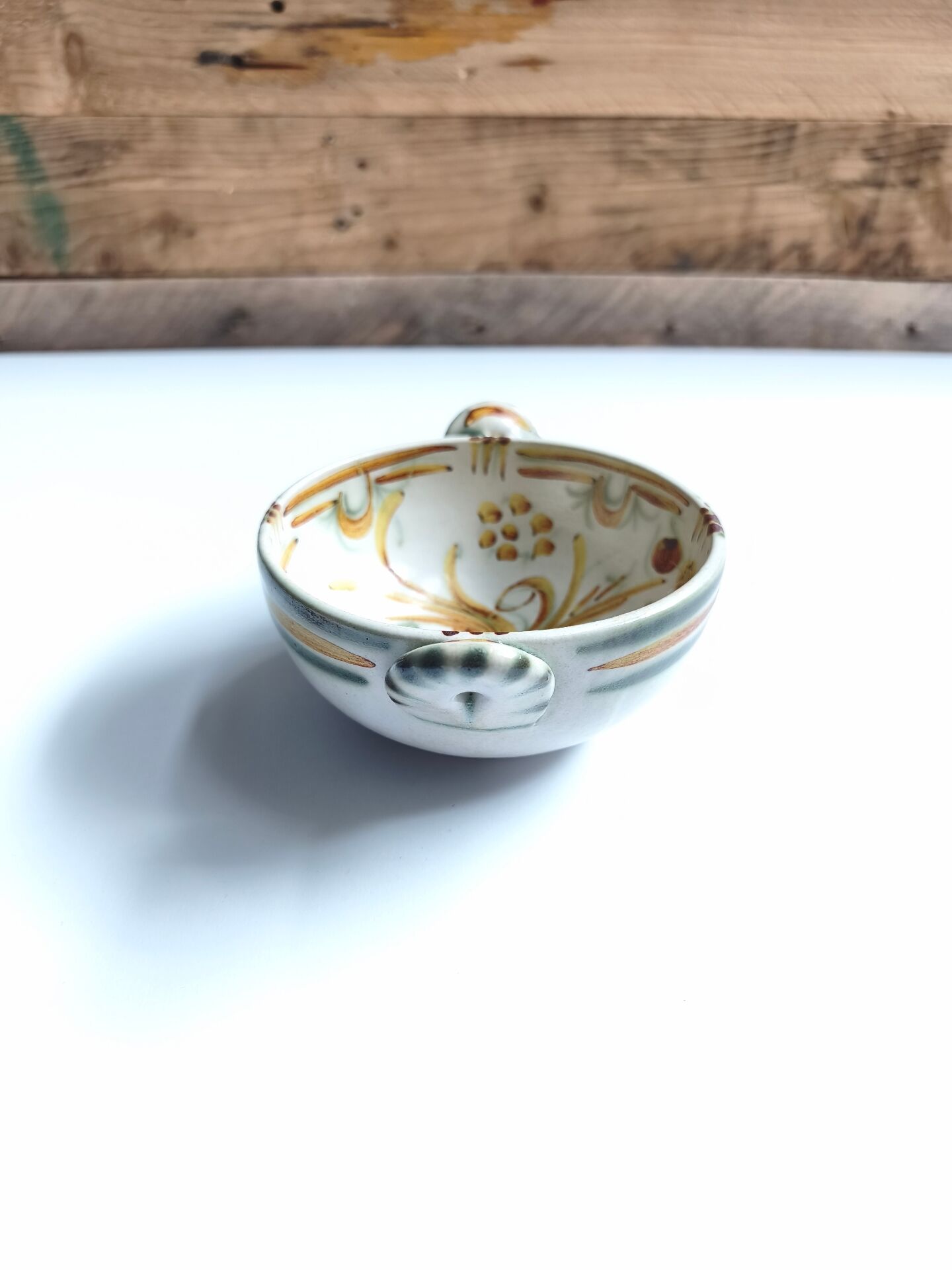 Vintage bowl signed Keraluc Quimper in yellow and green.