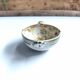 Vintage bowl signed Keraluc Quimper in yellow and green.