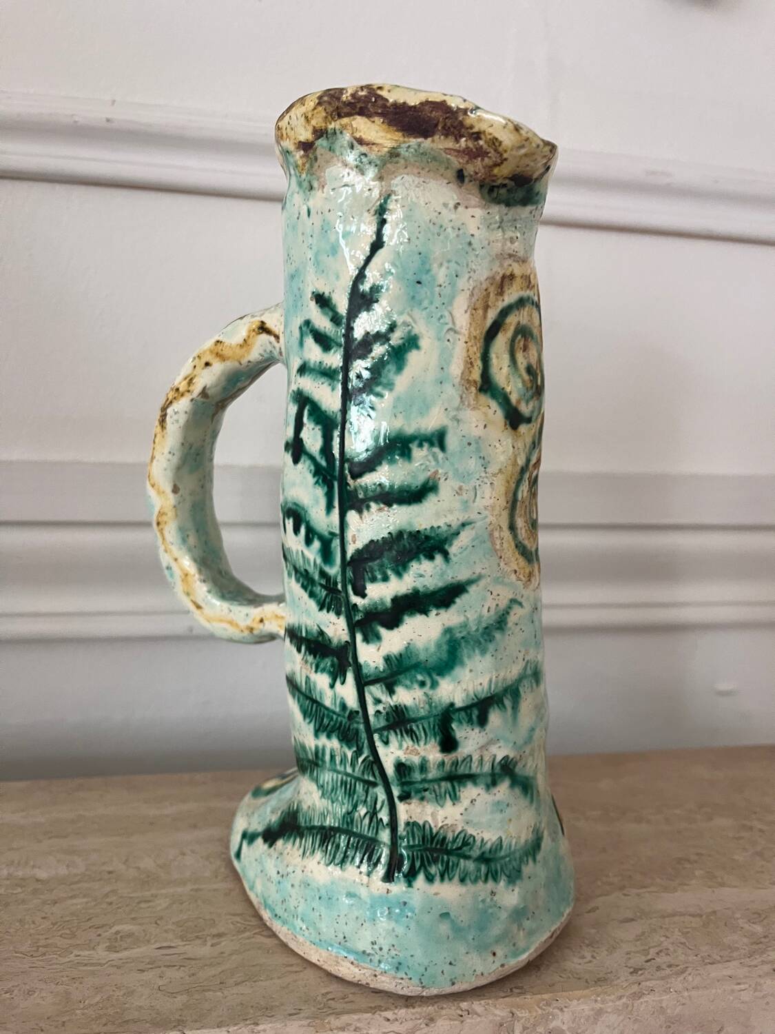 Antique handcrafted ceramic pitcher