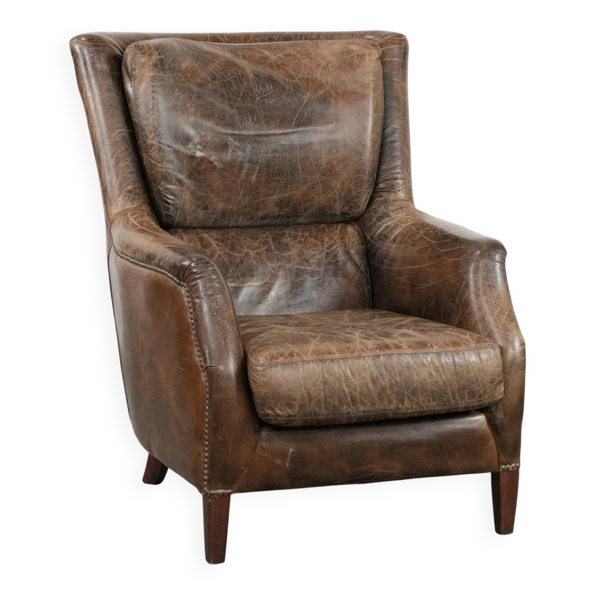 Very comfortable vintage cow leather armchair with character