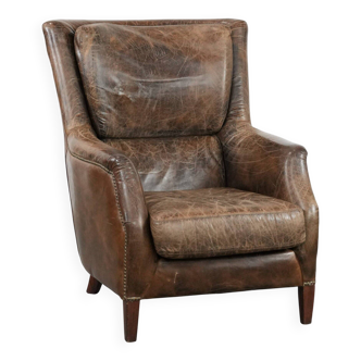 Very comfortable vintage cow leather armchair with character