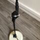 Desk lamp has two articulated metal arms
