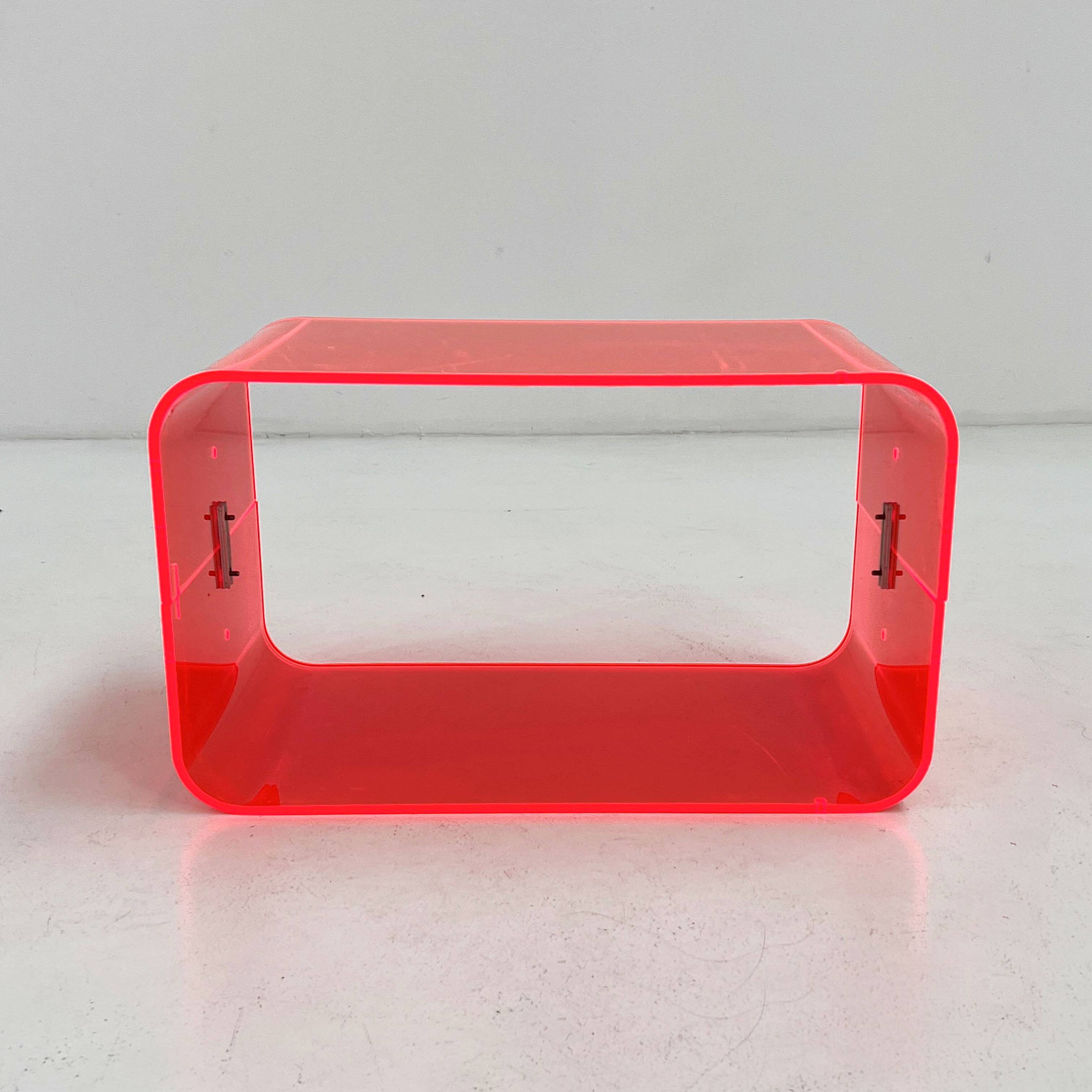 Fluorescent pink plexiglass coffee table, 1980.