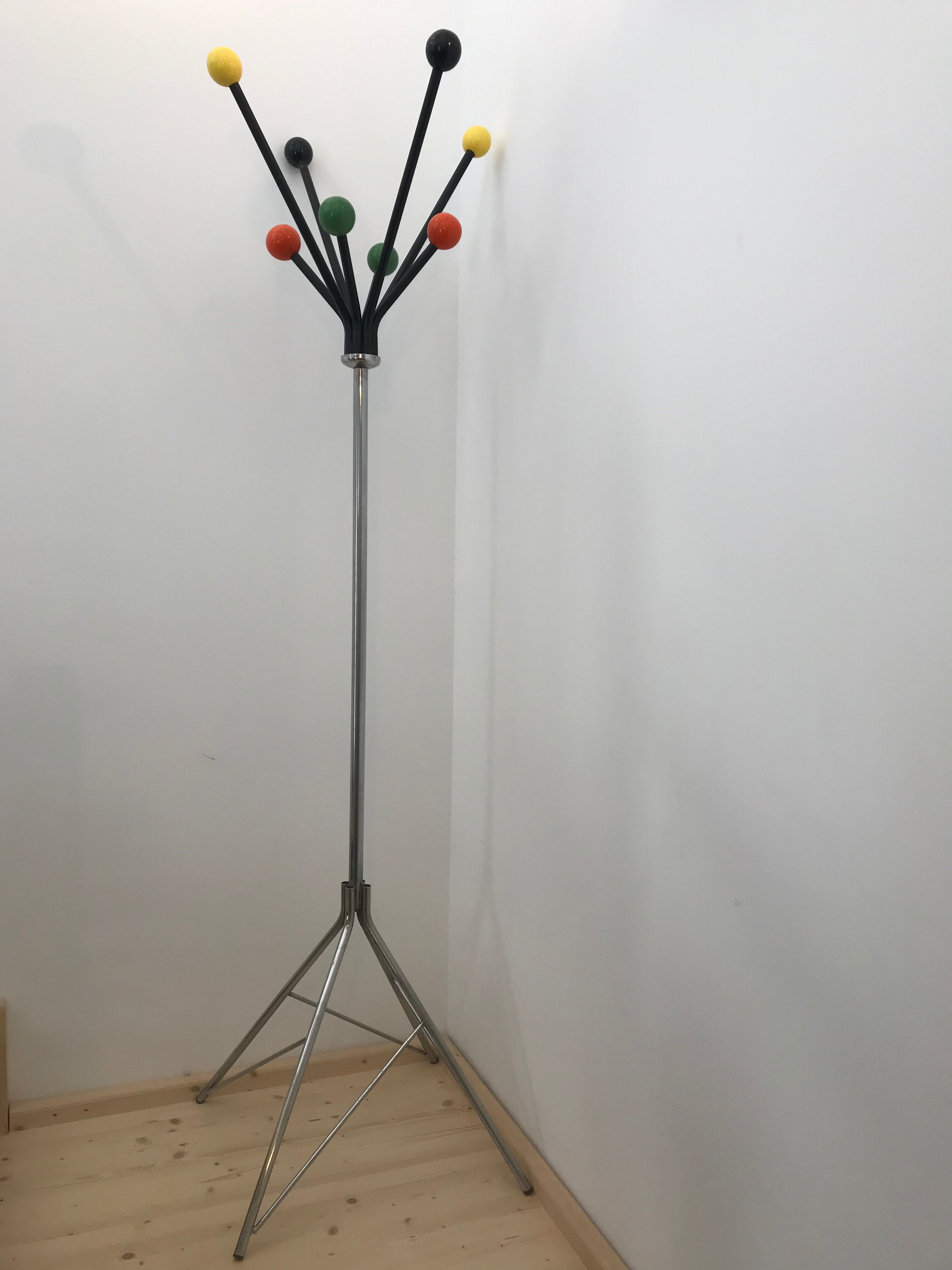 Wearing chrome parrot coat, black and multicolored balls