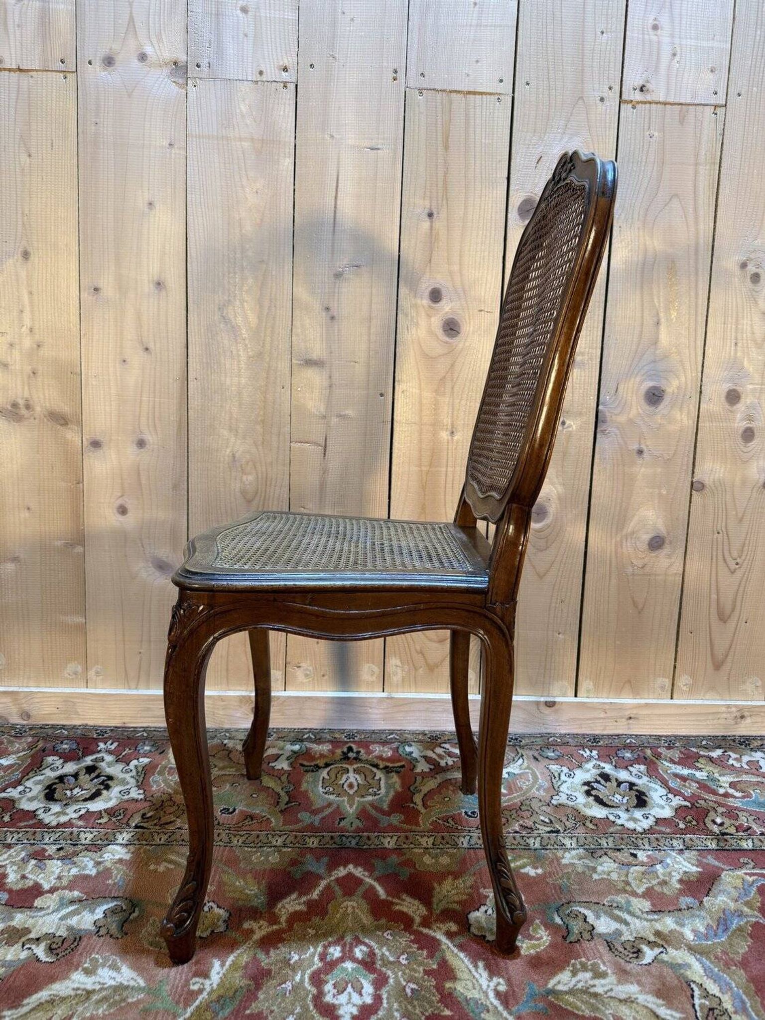 Set of 10 Louis XV style chairs in walnut and cane.