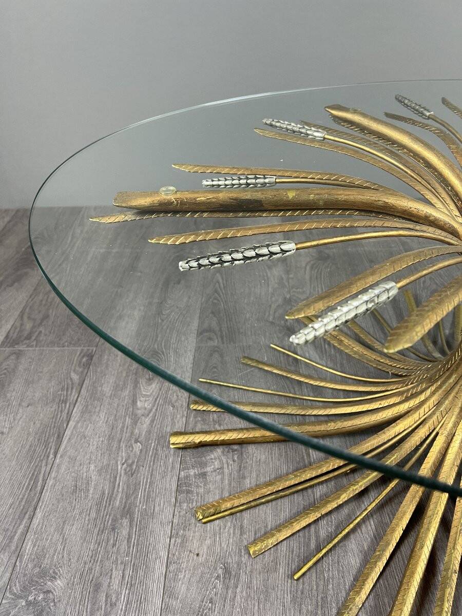 Gold metal and glass coffee table, 20th century, in the style of Robert Goos.