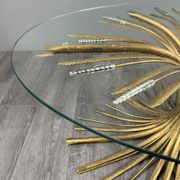 Gold metal and glass coffee table, 20th century, in the style of Robert Goos.