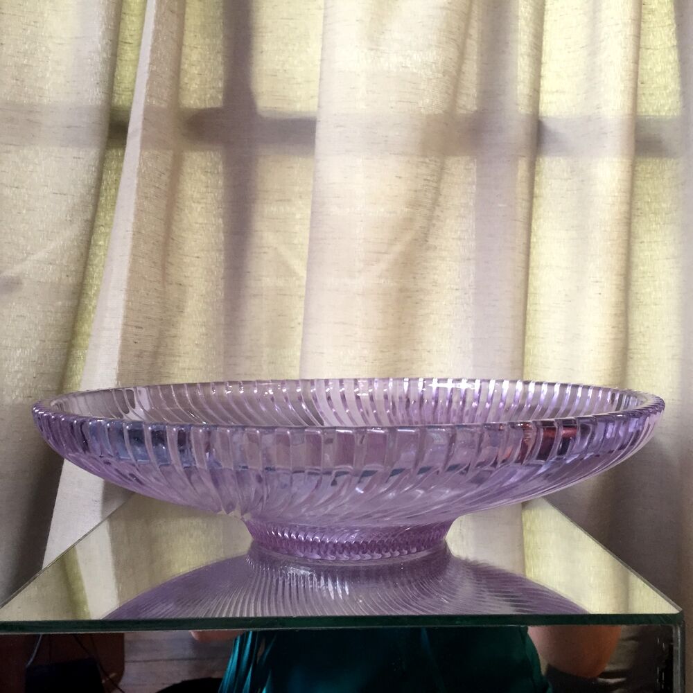 Twisted glass fruit cup of purplish pink color
