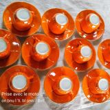 Iridescent orange porcelain coffee set from the 50s-60s with black edging