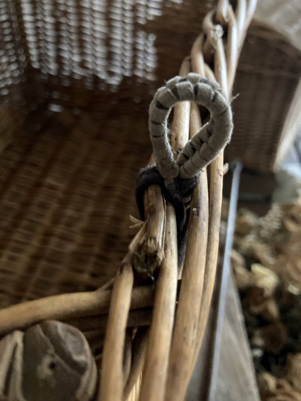 Antique wicker basket with closure and handle
