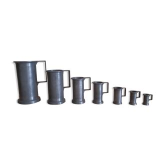 Set of 7 pots of tin measurements