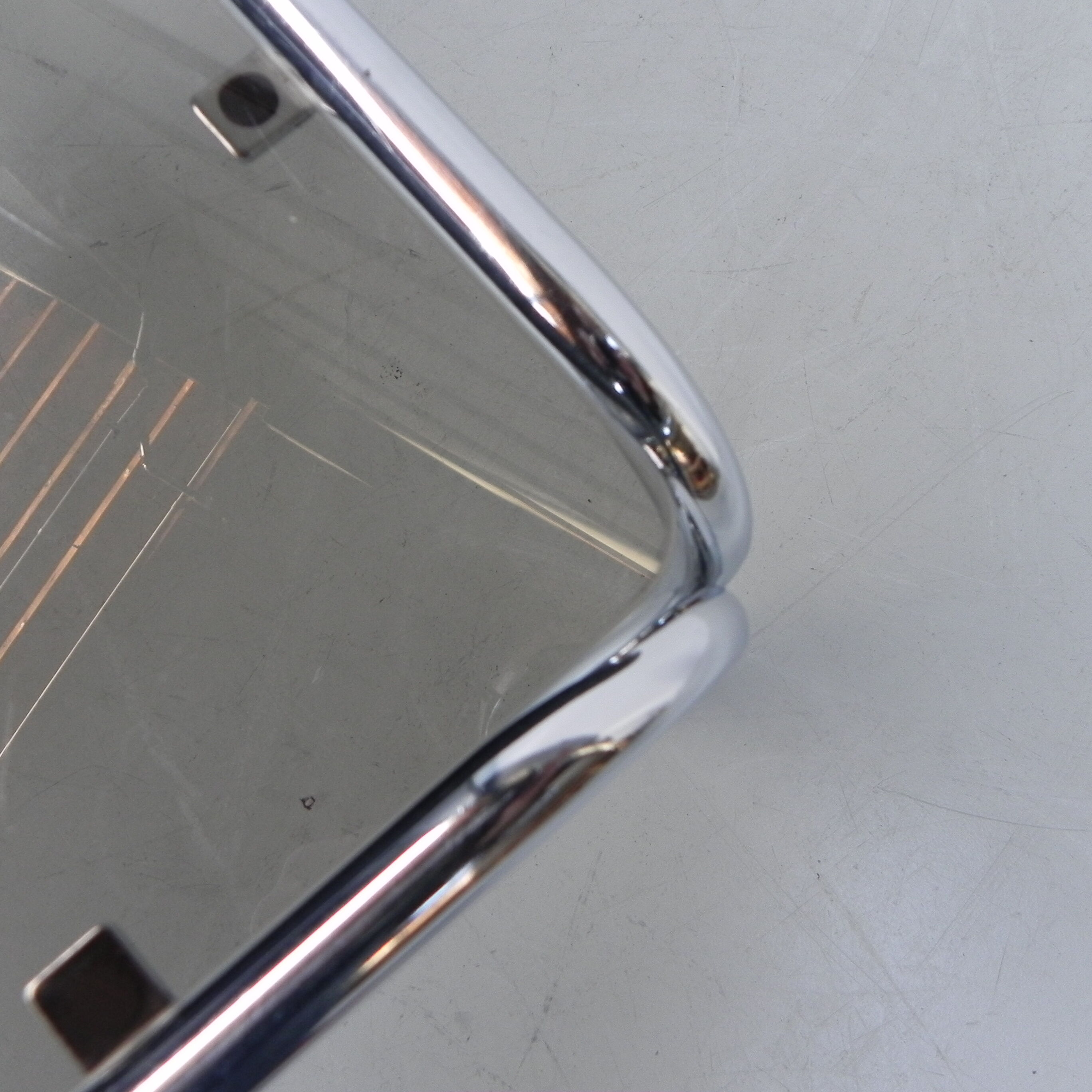 Coffee table with smoked glass top in chromed frame