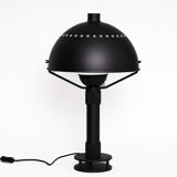 Matte black metal lamp signed by hand by its creator Marc Held