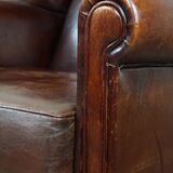 English style sheepskin leather wingback chair in a cognac color