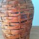 Demijohn surrounded by wicker