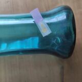 Blown glass vase with a flared neck and wavy rim.