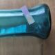 Blown glass vase with a flared neck and wavy rim.