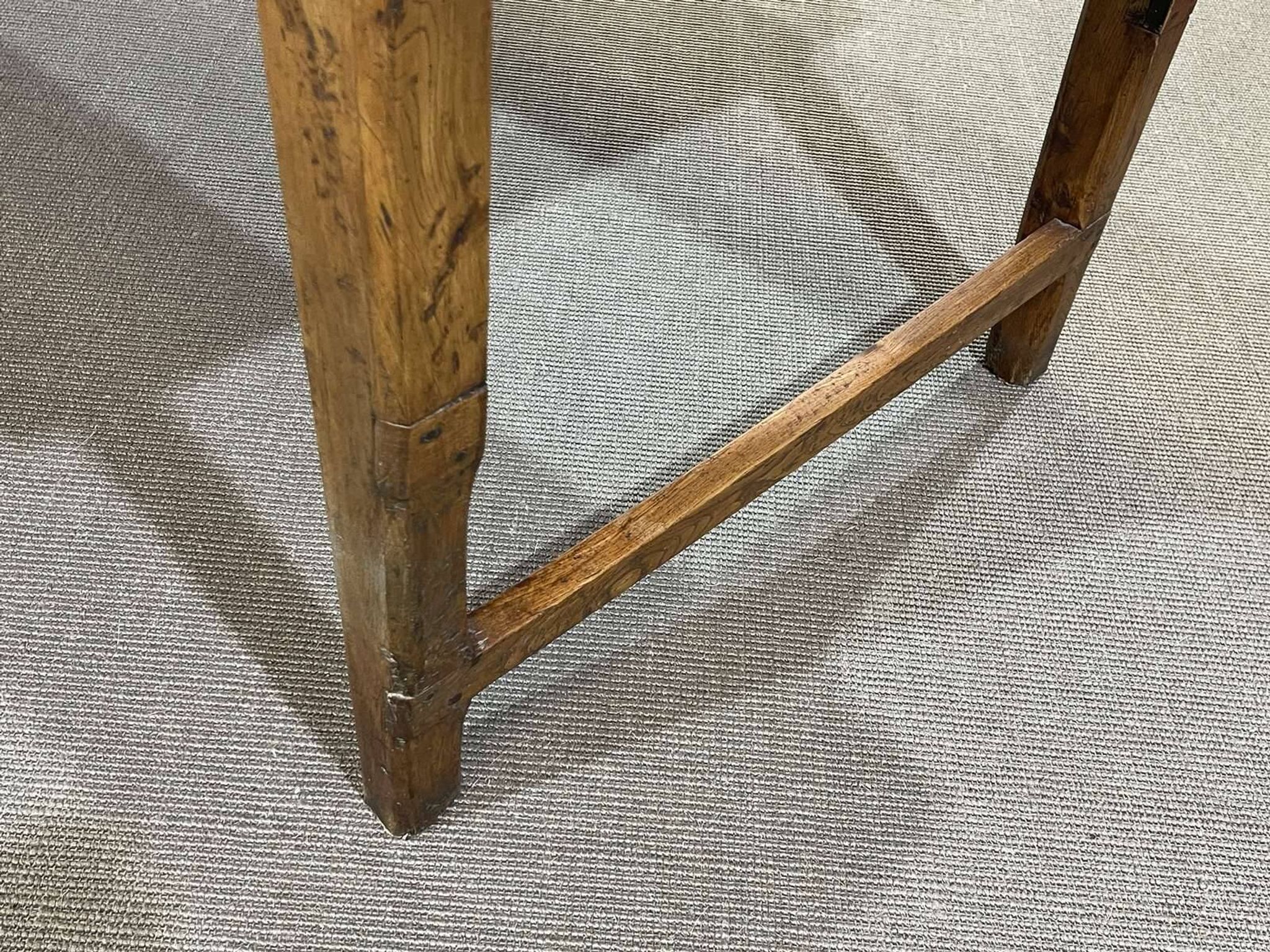 Early 20th-century farmhouse table made of fir, elm, and chestnut.
