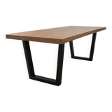 Modern table with metal legs and a natural varnished solid oak top