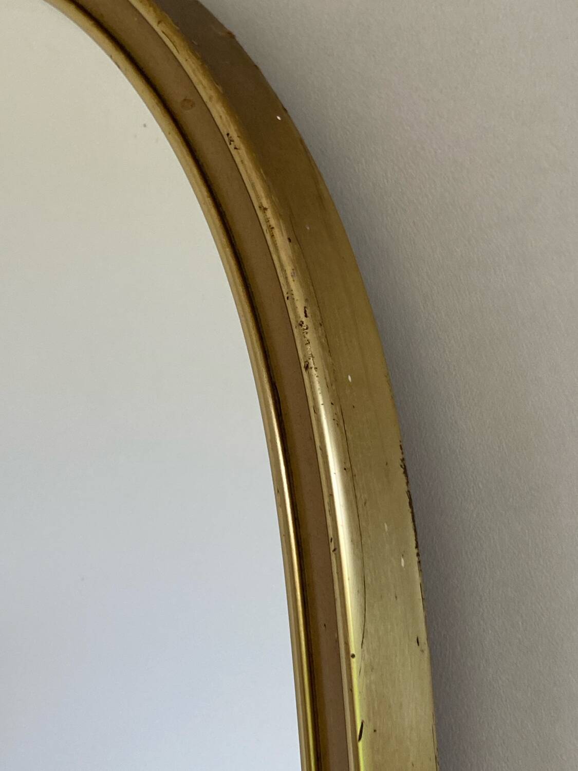 Vintage brass mirror in rear-view mirror shape