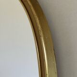 Vintage brass mirror in rear-view mirror shape