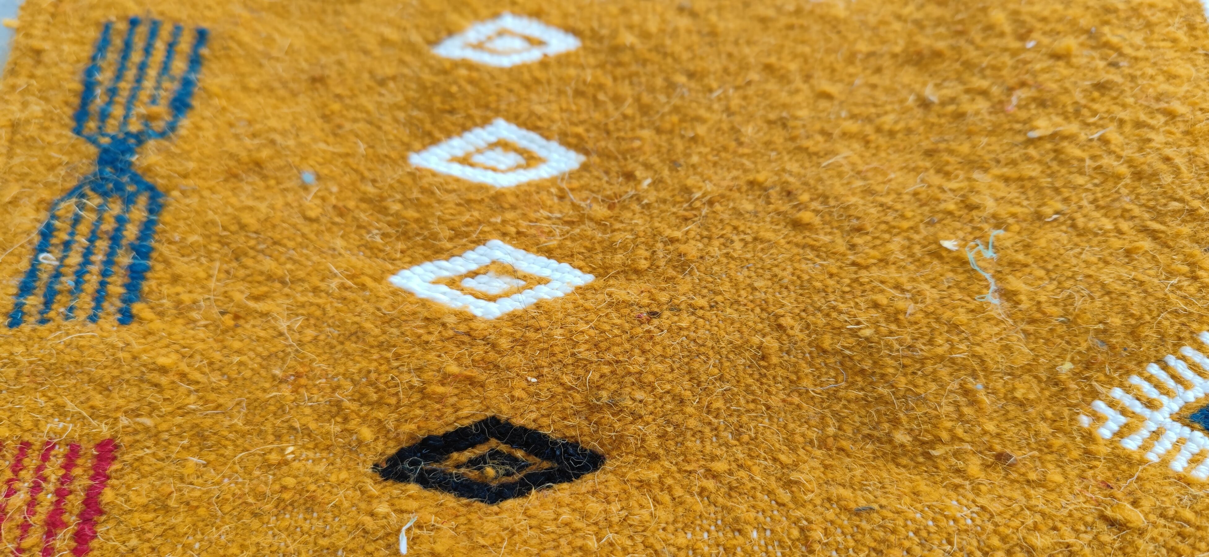 Mustard yellow kilim carpet with multicolored berber patterns