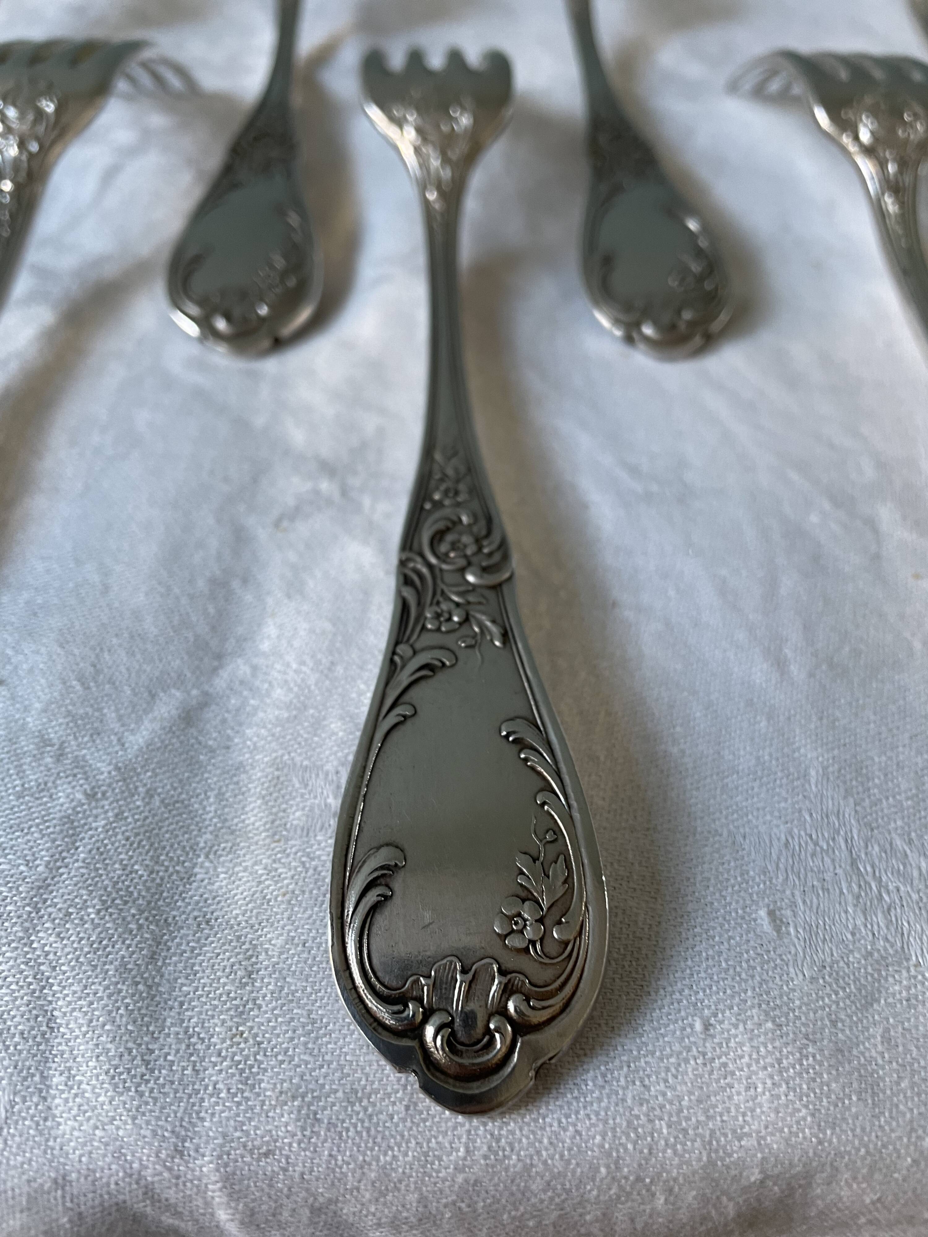 Series of 21 antique silver metal table forks