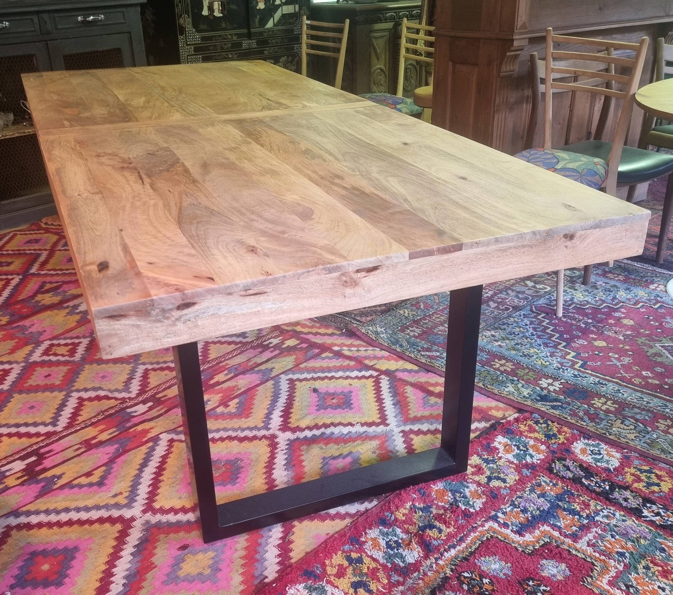Large mango wood table with contemporary base