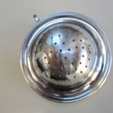 Silver metal tea strainer