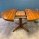 Expandable round table with butterfly extension