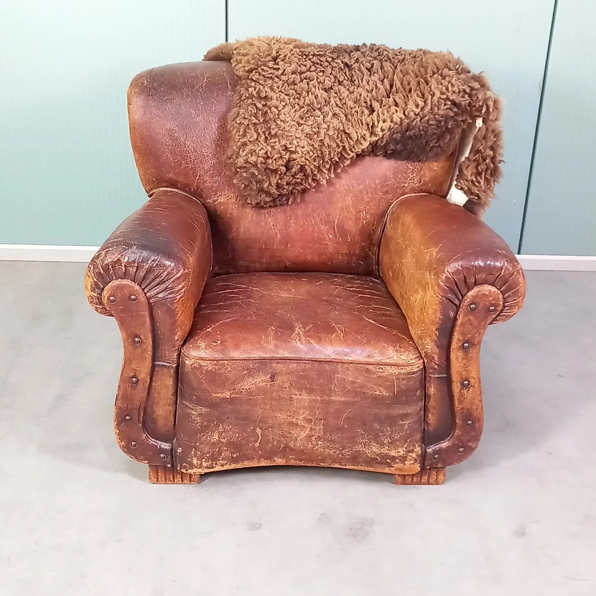Leather nailed armchair