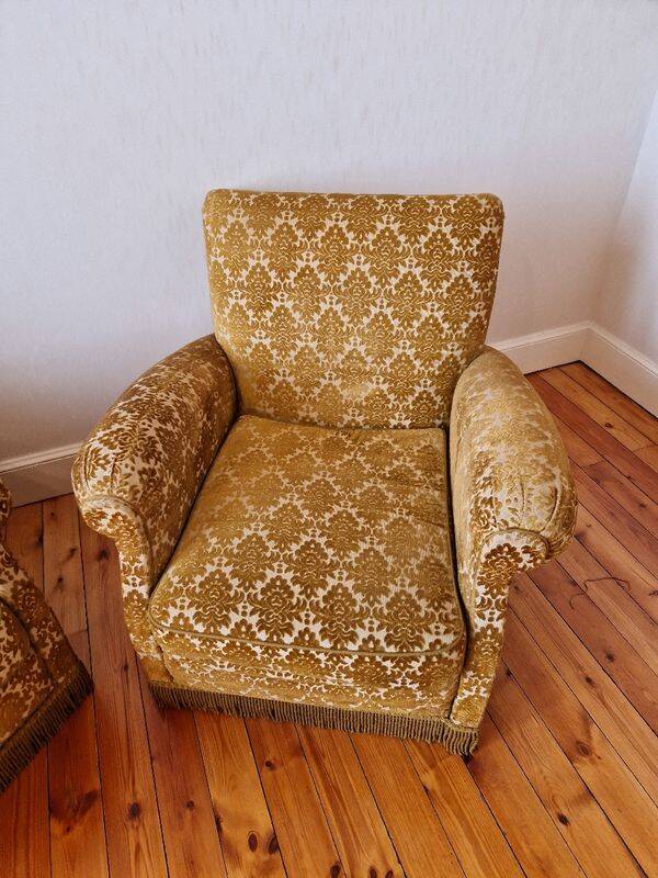 Pair of golden fringed armchairs