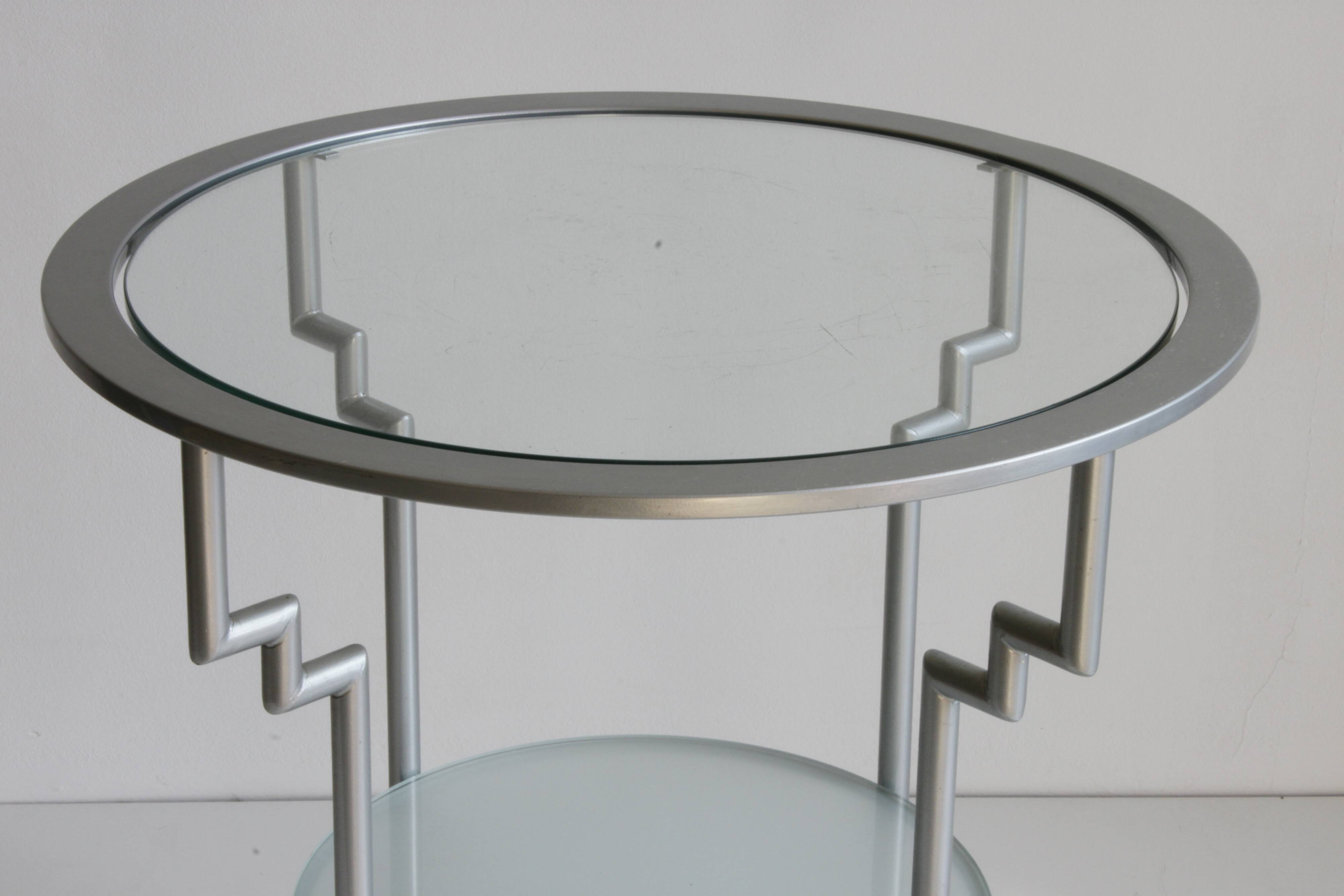Postmodern round glass  and steel side table, 1980s.