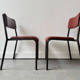 Pair of vintage stacking chairs with red vinyl upholstery